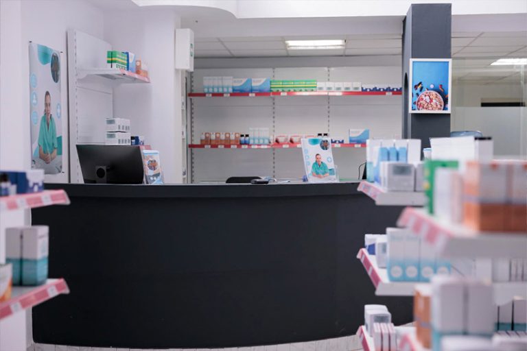 Empty pharmacy shelves full with pharmaceutical products ready for opening
